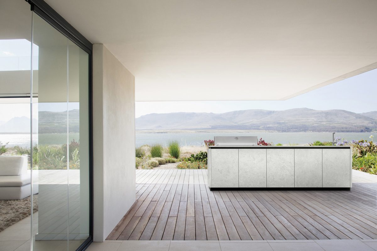View of lake from patio of modern house